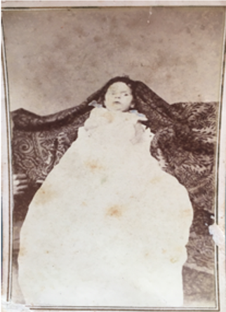 Victorian photograph of a baby in a christening dress